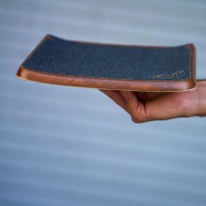 Profile view of Future Motion OneWheel Surestance Footpad with black grip tape.