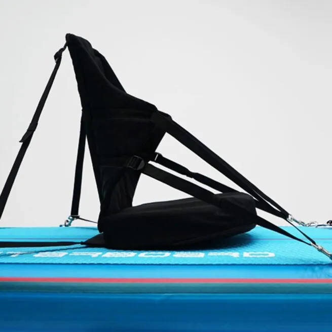 Black hammock chair on blue mat, adjustable straps.