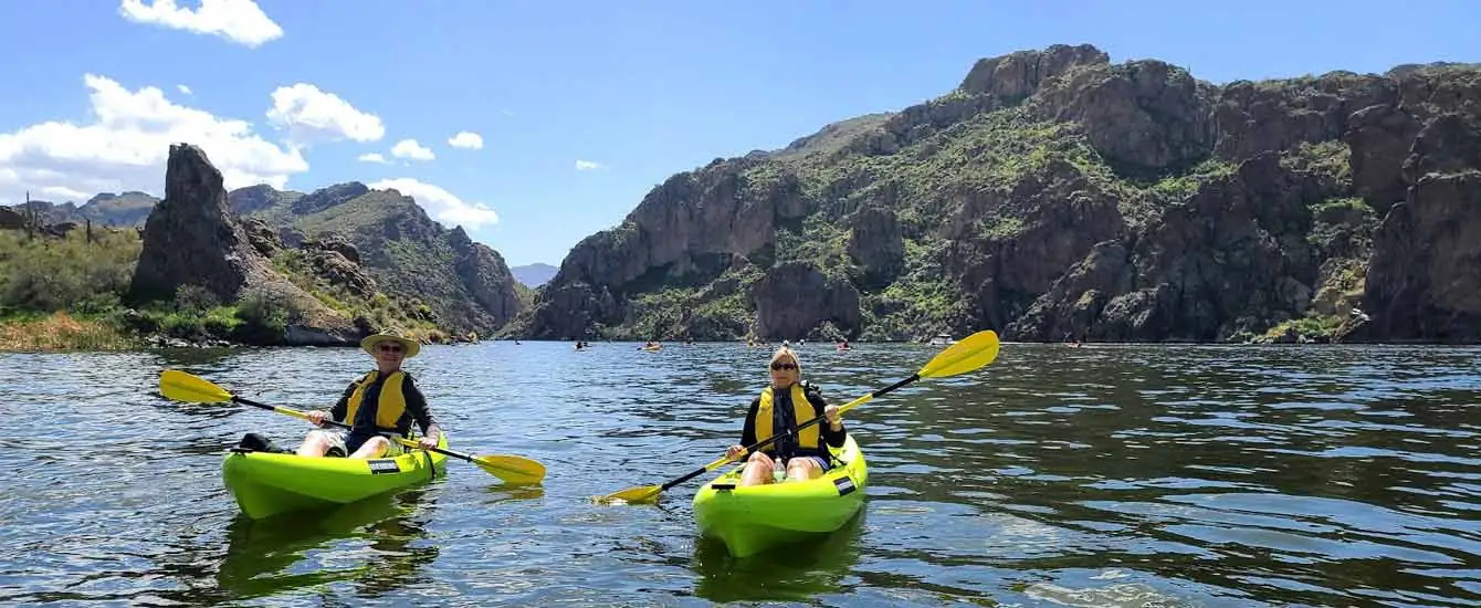 A couple enjoying a Kayaking Tour at Saguaro Lake just outside Scottsdale and Mesa, Arizona. Come join Riverbound on one of our Phoenix area tours.