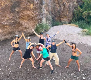 Bachelorette Party posing joyfully outdoors at Willow Springs on Saguaro Lake. Riverbound Sports Paddle Company