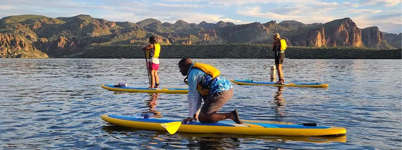 Paddleboarding lessons on Saguaro Lake with the mountain backdrop. Riverbound Paddle Company Paddleboard Lessons