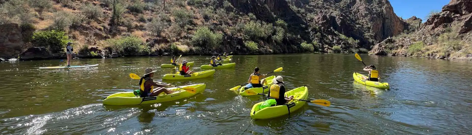 Group kayaking on a Riverbound Sports Saguaro Lake tour. Riverbound Sports Paddle Company Tours.
