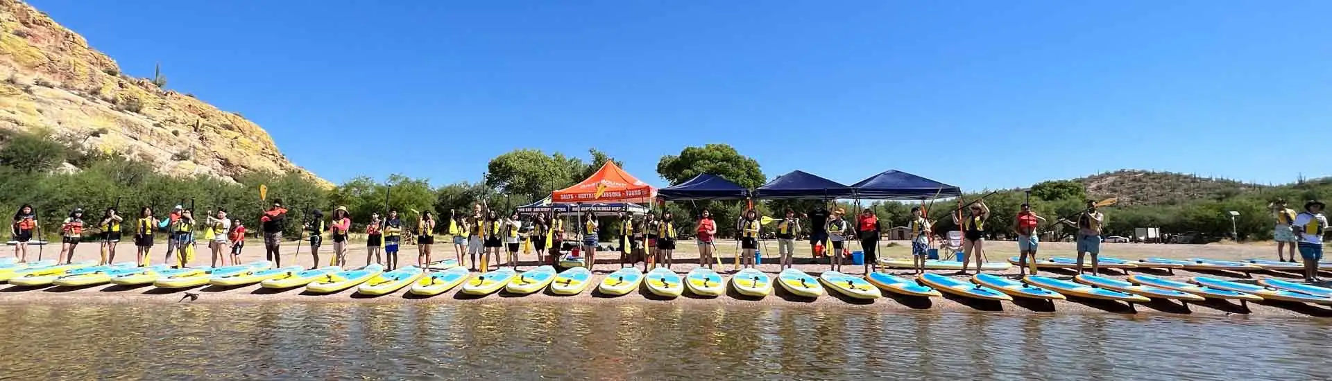 Outdoor kayaking school event at Saguaro Lake in Mesa, Arizona. Riverbound Sports Paddle Company events