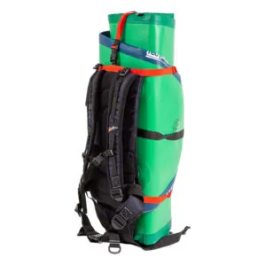 Red Paddle Co ATB Transformer bag straps on green inflatable SUP.