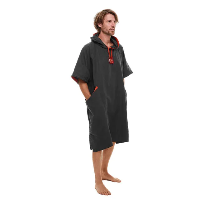 Man modeling gray Red Paddle Co hooded quick dry changing robe with red accents front angled view. Available at Riverbound Sports in Tempe, Arizona.