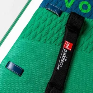 Green textured paddleboard with black strap and logo.
