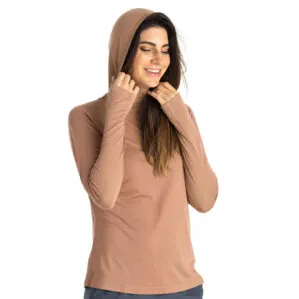 Woman in canyon clay lightweight bamboo hoodie. Available at Riverbound Sports in Tempe, Arizona.