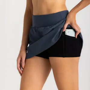 Woman in Free Fly Breeze blue dus II skorts with phone pocket. Available at Riverbound Sports in Tempe, Arizona.