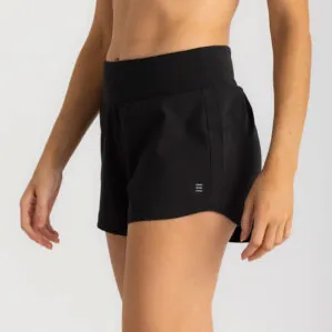 Woman wearing black Free Fly Breeze Bamboo athletic shorts, close-up view. Available at Riverbound Sports in Tempe, Arizona.