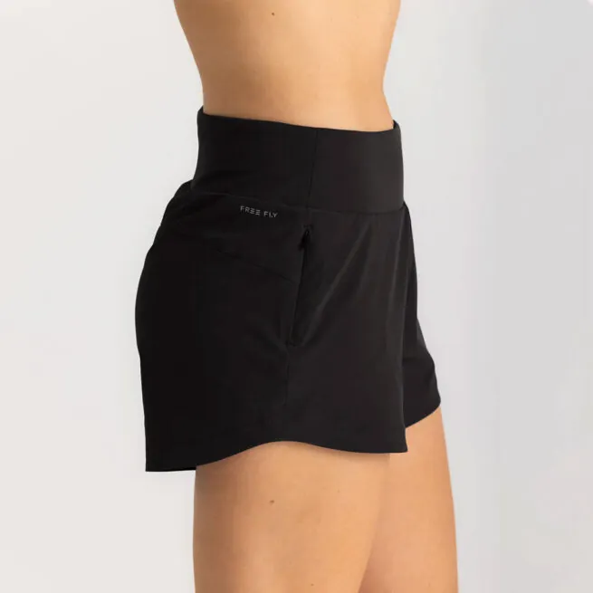 Woman wearing black Free Fly Breeze Bamboo athletic shorts, side view. Available at Riverbound Sports in Tempe, Arizona.