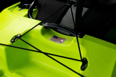 Close-up of neon green kayak with American flag sticker