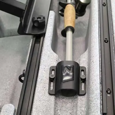 Fishing rod secured in boat-mounted rod holder