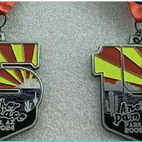 Four colorful race medals from Parker, AZ event