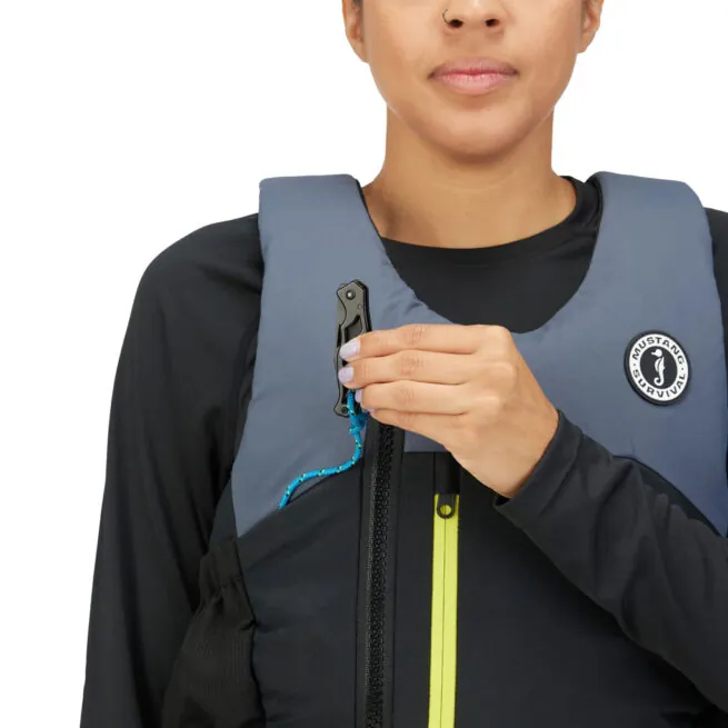 Woman demonstrating life vest zip mechanism close-up