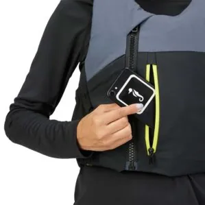 Person inserting a smartphone into a Mustang POD 50 PFD pocket at Riverbound Sports