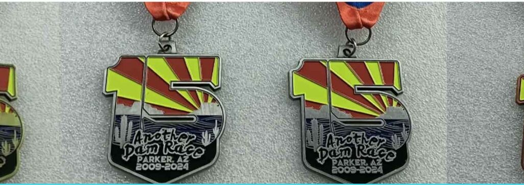 Four colorful race medals from Parker, AZ event