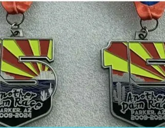 Four colorful race medals from Parker, AZ event