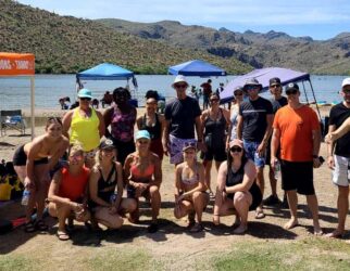Group of people enjoying lakeside outdoor Paddleboard Pilates & SUP Yoga with Pam at Butcher Jones, Saguaro Lake.